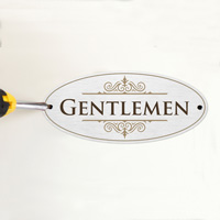 Silver restroom sign