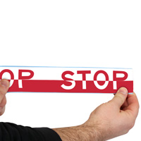 Yellow floor marking tape with 'Stop' message