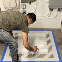 Painting an electical panel warning stencil